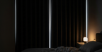 Dark peaceful bedroom at noon with blackout curtains for night shift daytime sleep