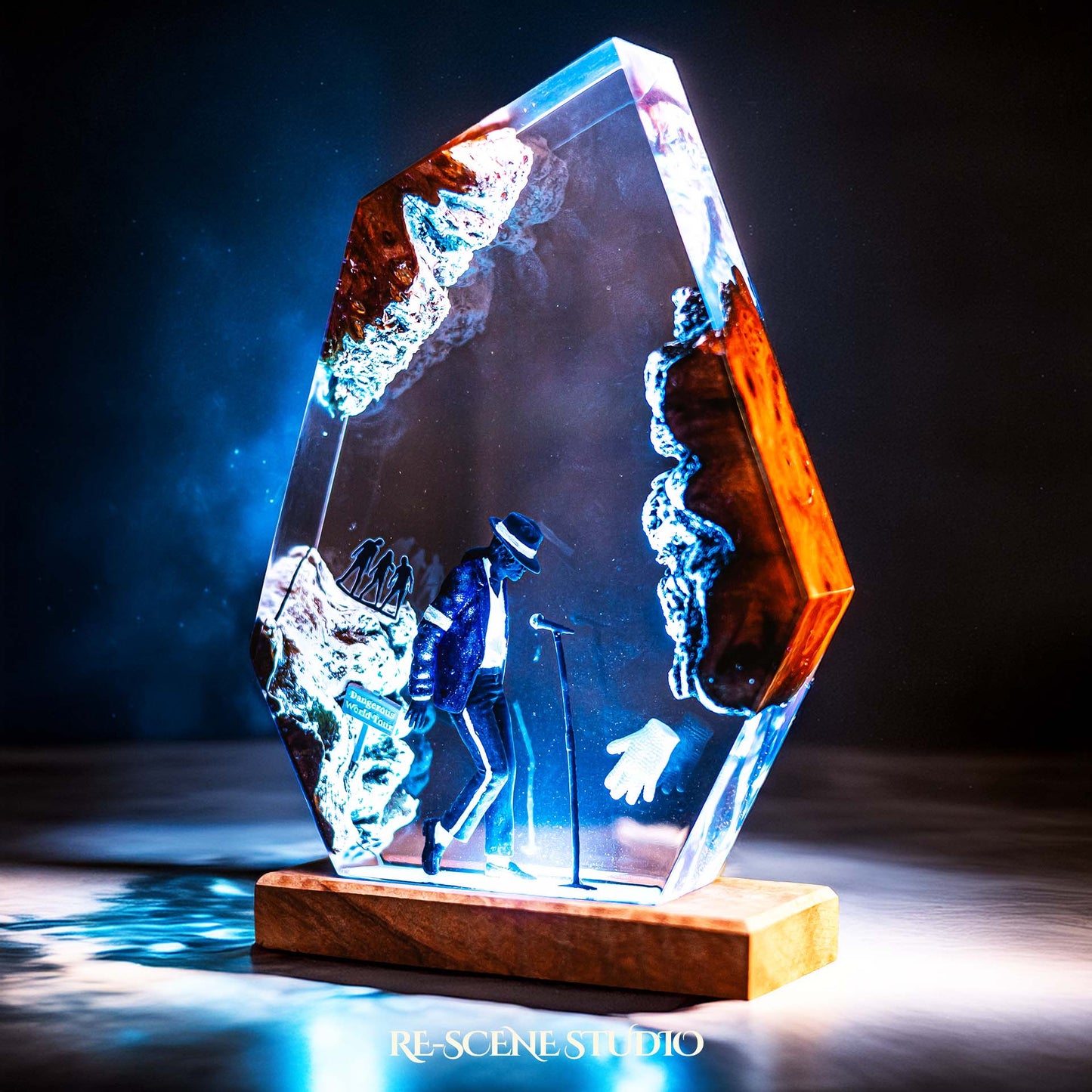Handmade epoxy resin table lamp showing a dancer in a fedora and sparkling jacket leaning toward a microphone stand under a spotlight, on a natural wood LED base (view 6)