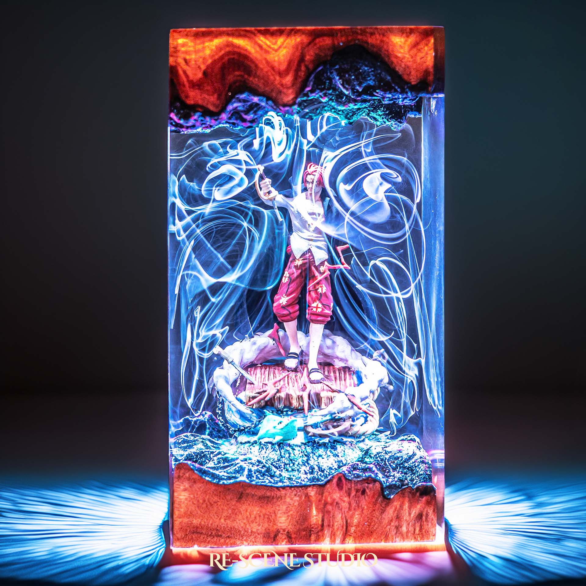 Red-haired pirate emperor with arm raised on a ship handmade epoxy resin LED lamp on a wooden base – angled side view