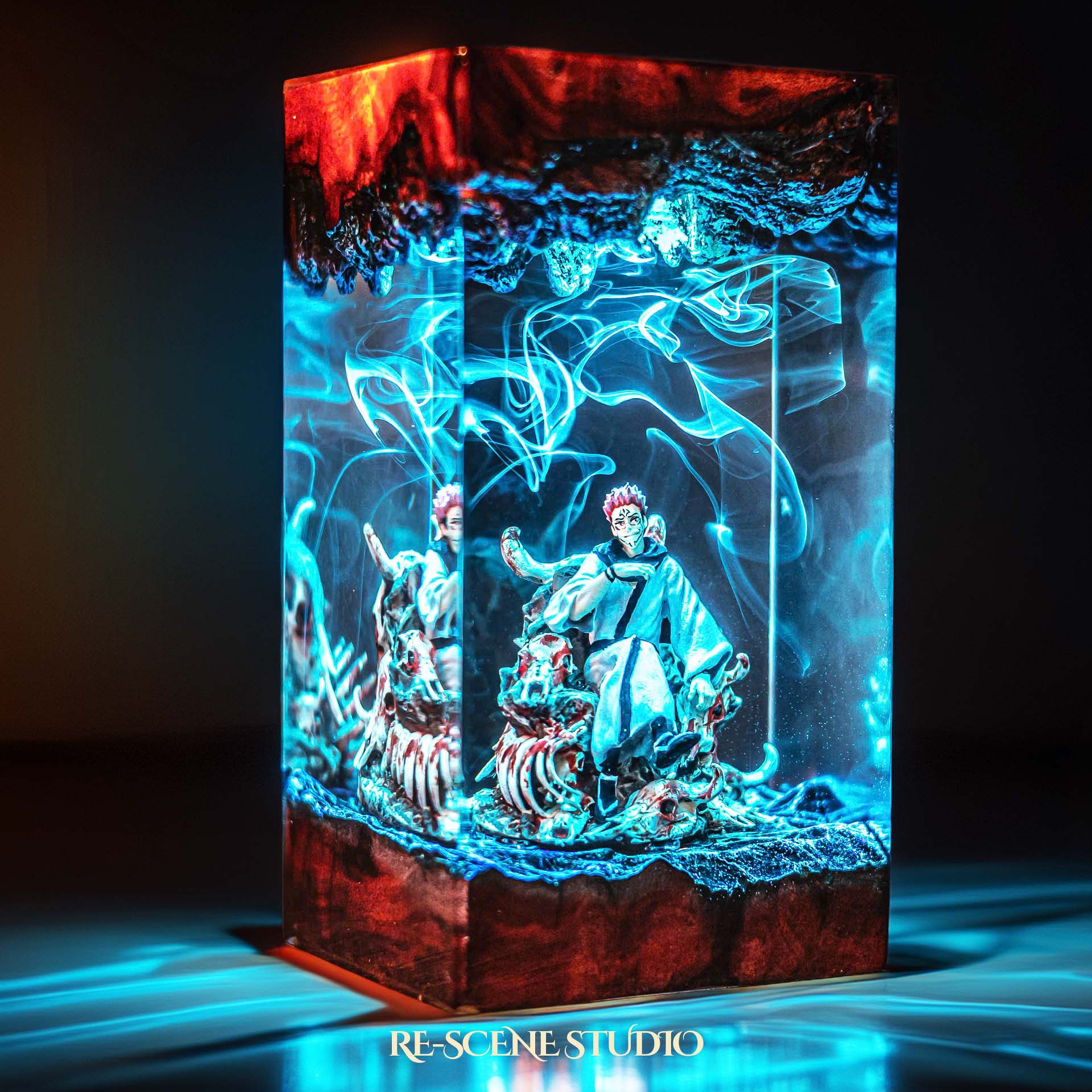 Red-haired curse king among a throne of skulls handmade epoxy resin LED lamp on a wooden base – desk display view