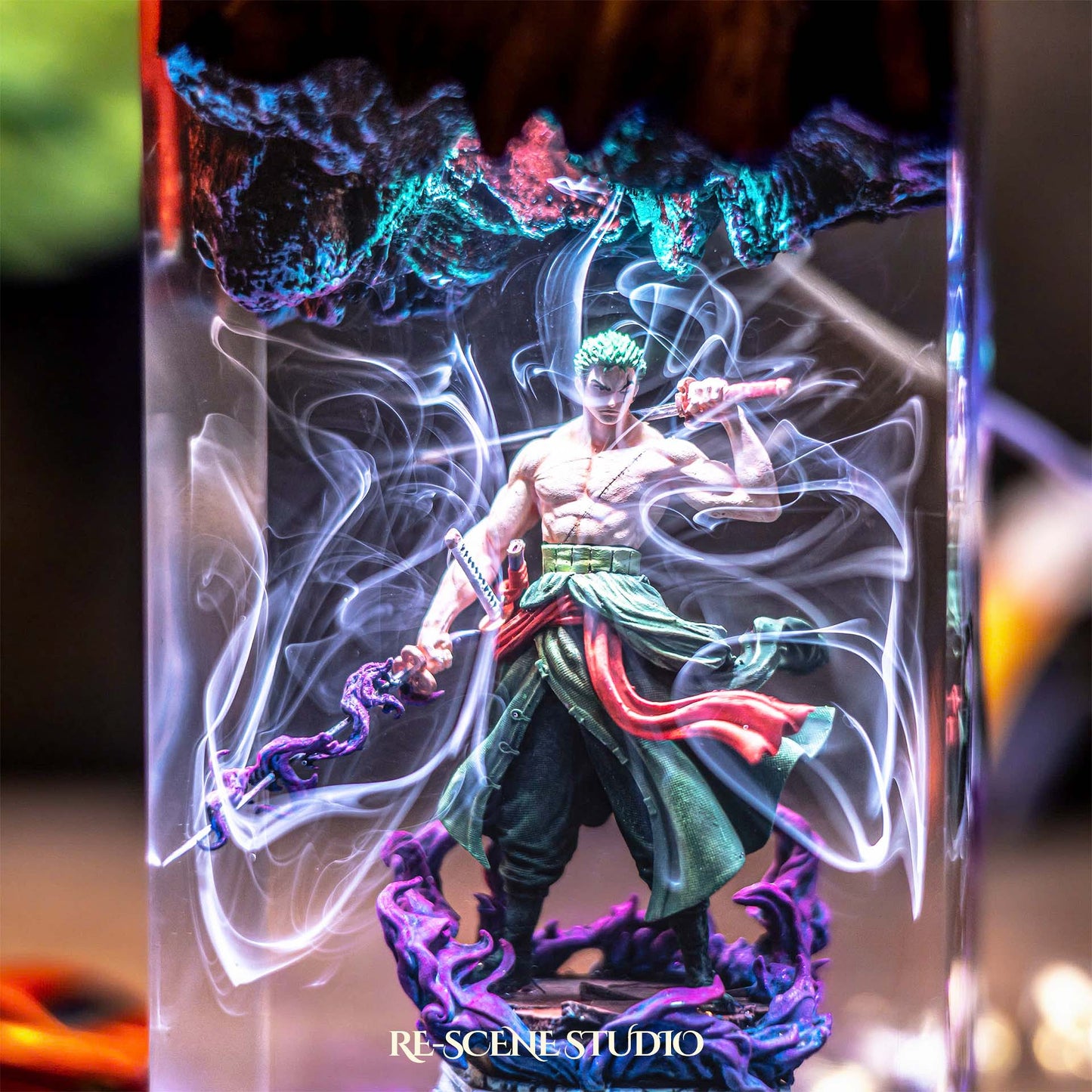 Green-clad three-sword swordsman mid-stance handmade epoxy resin LED lamp on a wooden base – angled side view