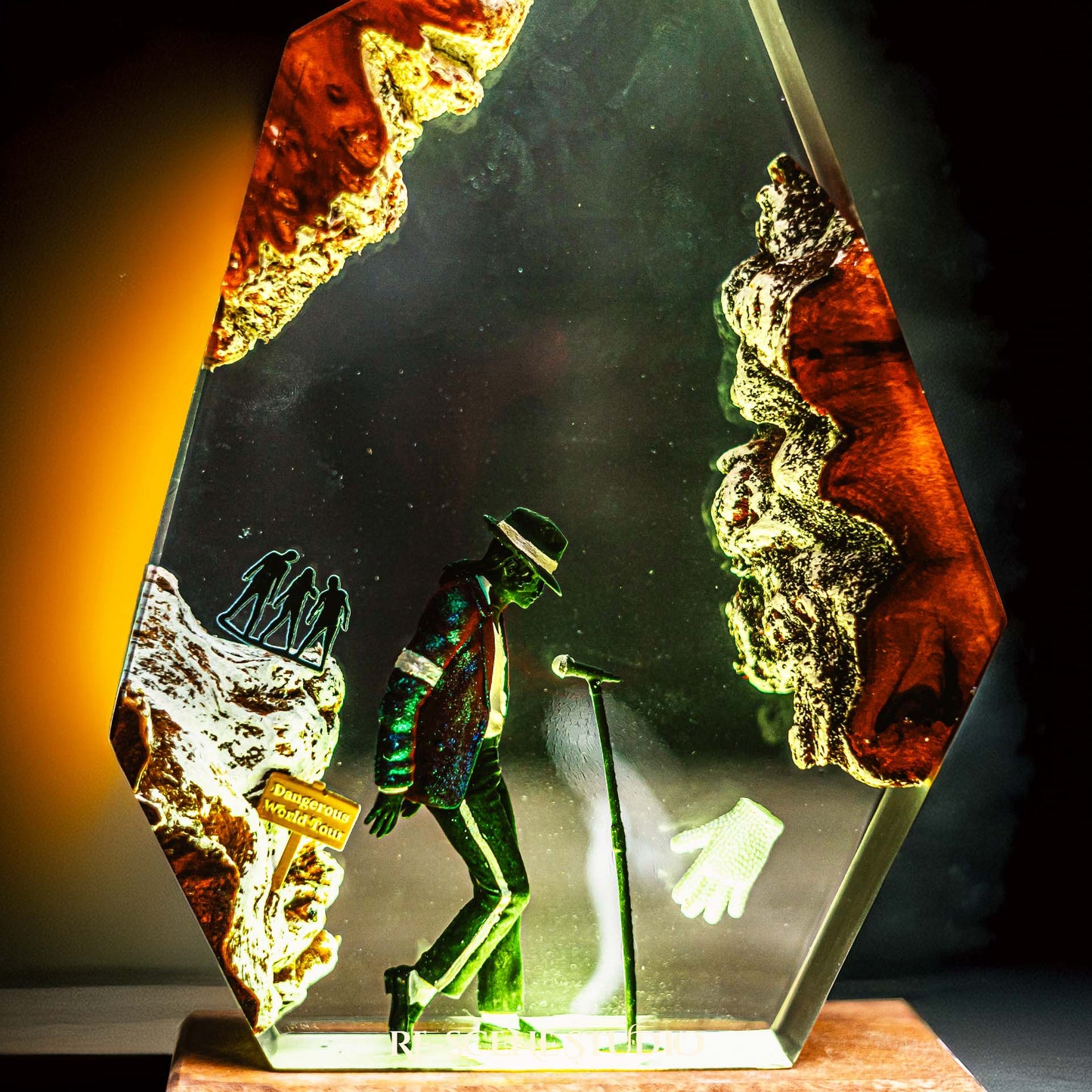 Handmade epoxy resin table lamp showing a dancer in a fedora and sparkling jacket leaning toward a microphone stand under a spotlight, on a natural wood LED base (view 9)