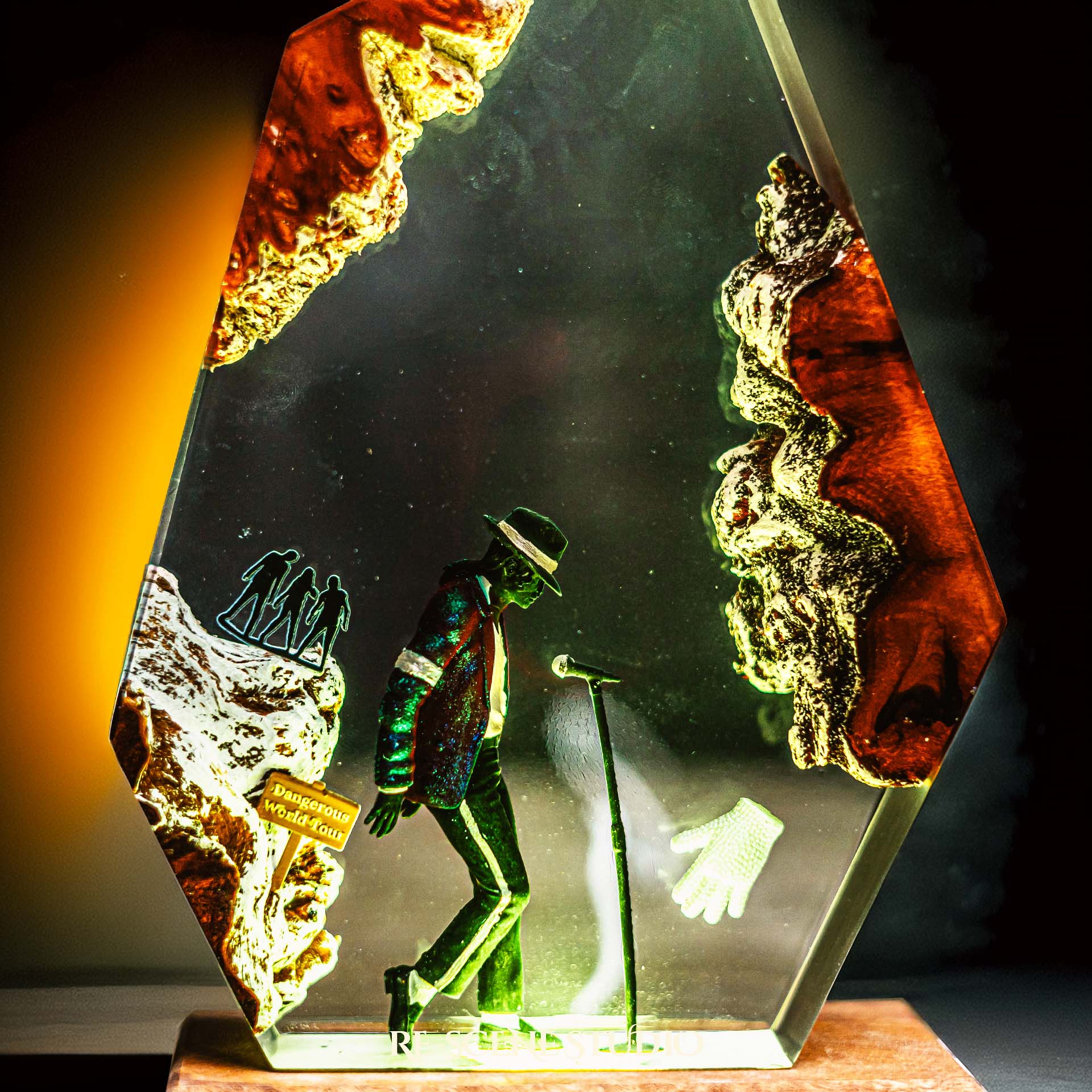 Handmade epoxy resin table lamp showing a dancer in a fedora and sparkling jacket leaning toward a microphone stand under a spotlight, on a natural wood LED base (view 9)