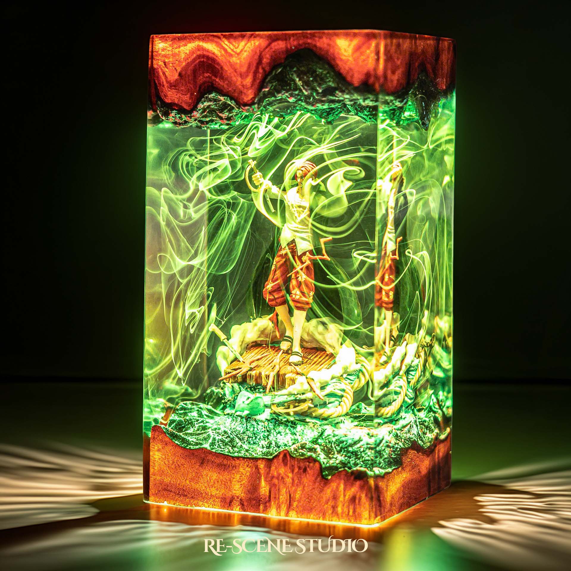 Red-haired pirate emperor with arm raised on a ship handmade epoxy resin LED lamp on a wooden base – close-up resin detail