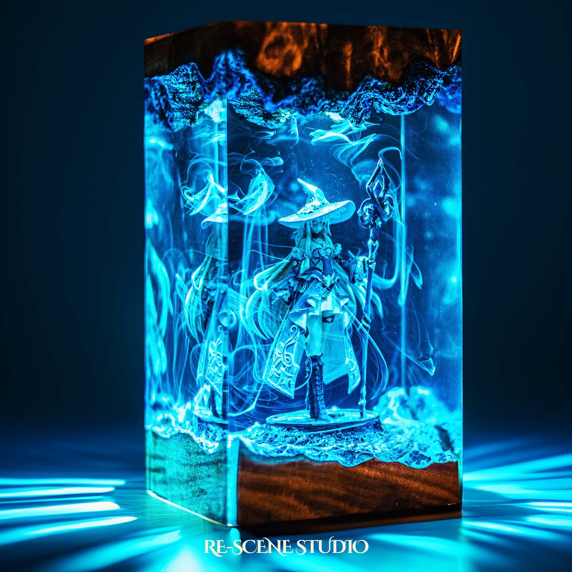 Witch sorceress with a wide hat and glowing staff handmade epoxy resin LED lamp on a wooden base – close-up resin detail