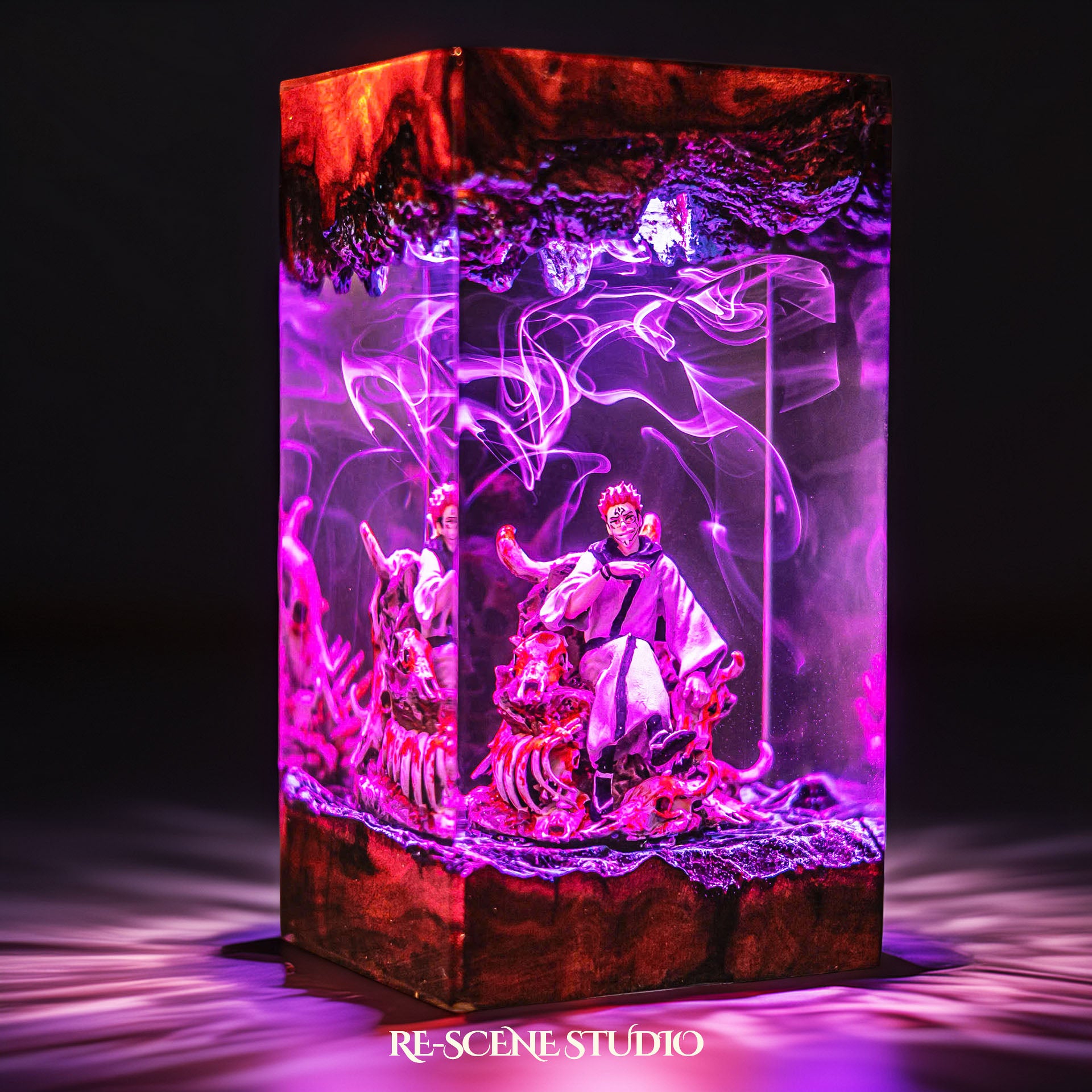 Red-haired curse king among a throne of skulls handmade epoxy resin LED lamp on a wooden base – size and scale view