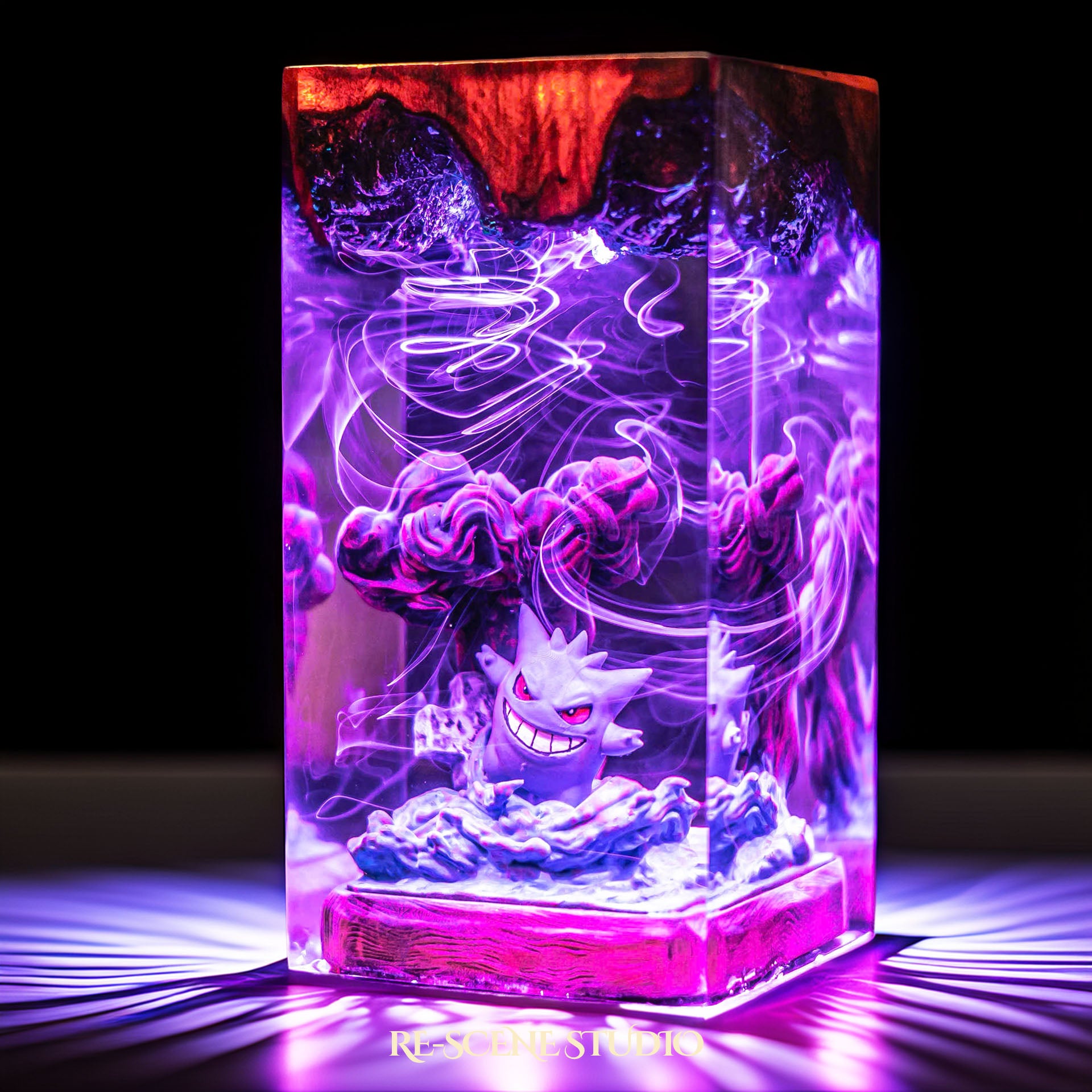 Grinning shadow phantom with a looming dark silhouette handmade epoxy resin LED lamp on a wooden base – size and scale view