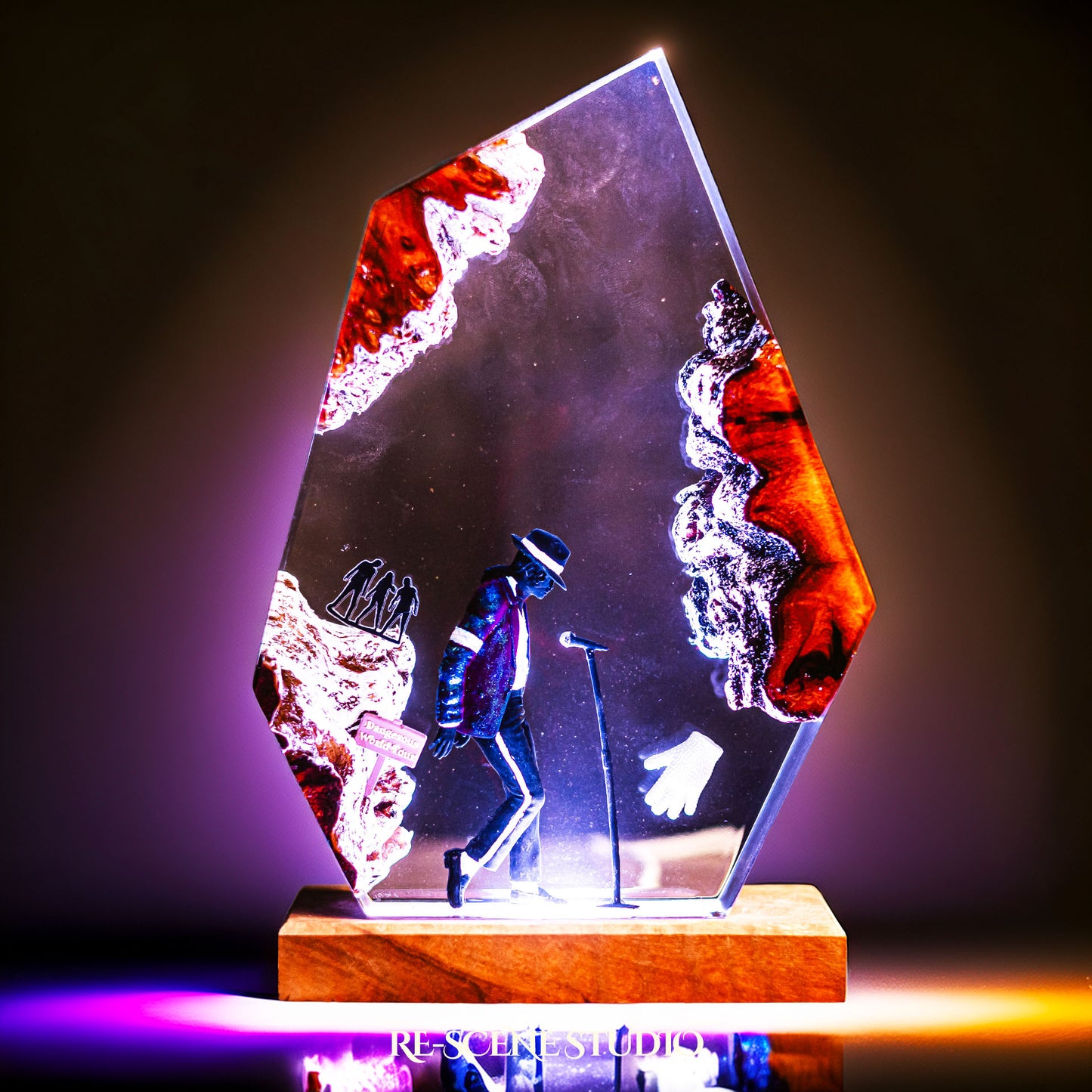 Handmade epoxy resin table lamp showing a dancer in a fedora and sparkling jacket leaning toward a microphone stand under a spotlight, on a natural wood LED base (view 1)