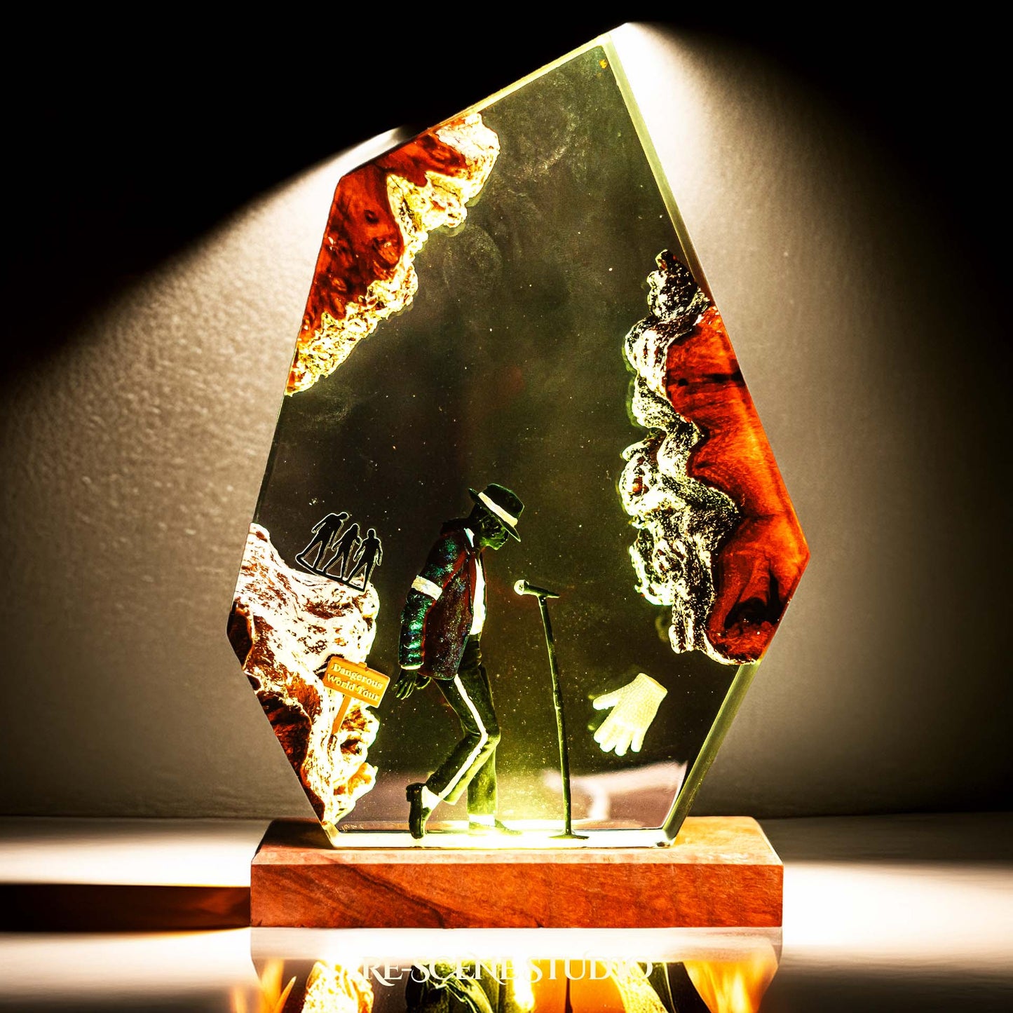 Handmade epoxy resin table lamp showing a dancer in a fedora and sparkling jacket leaning toward a microphone stand under a spotlight, on a natural wood LED base (view 4)
