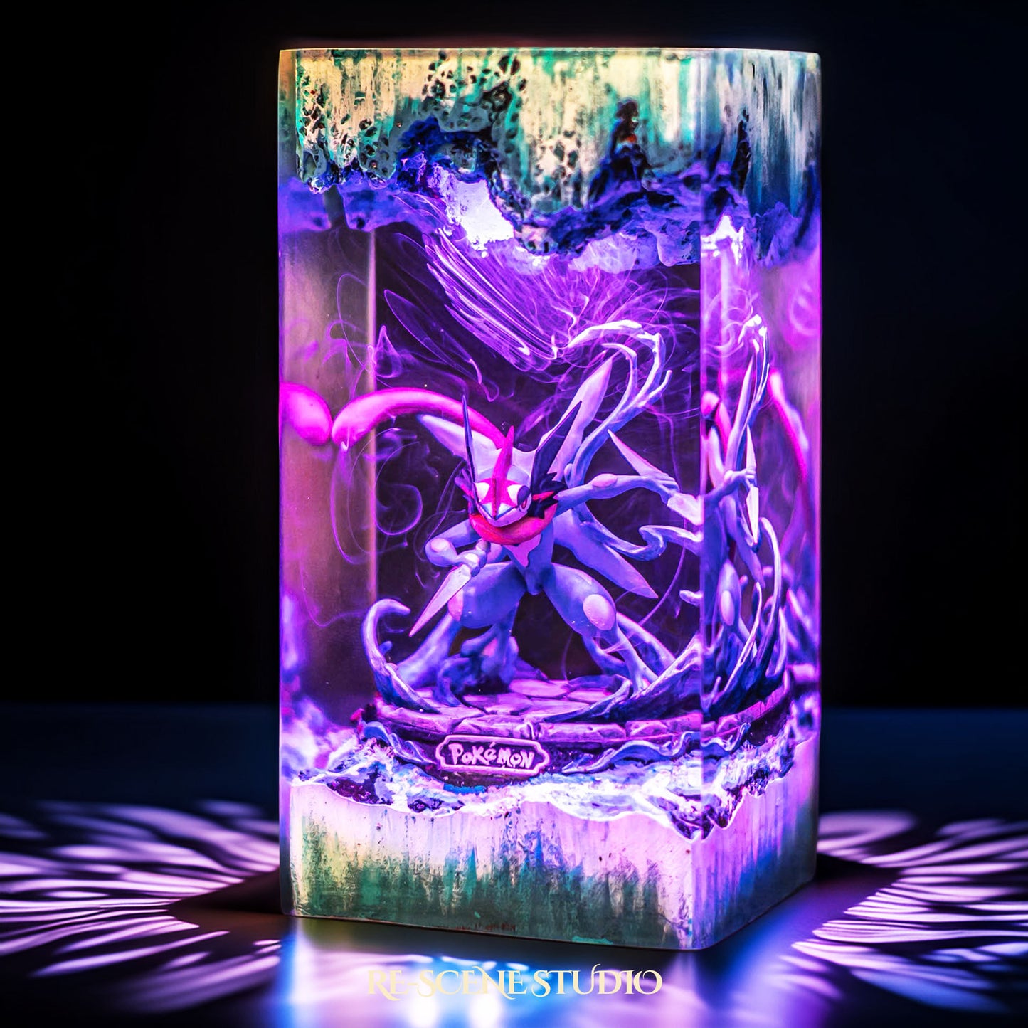 Blue ninja frog warrior with a giant water shuriken handmade epoxy resin LED lamp on a wooden base – front view, lit