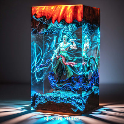 Green-clad three-sword swordsman mid-stance handmade epoxy resin LED lamp on a wooden base – desk display view