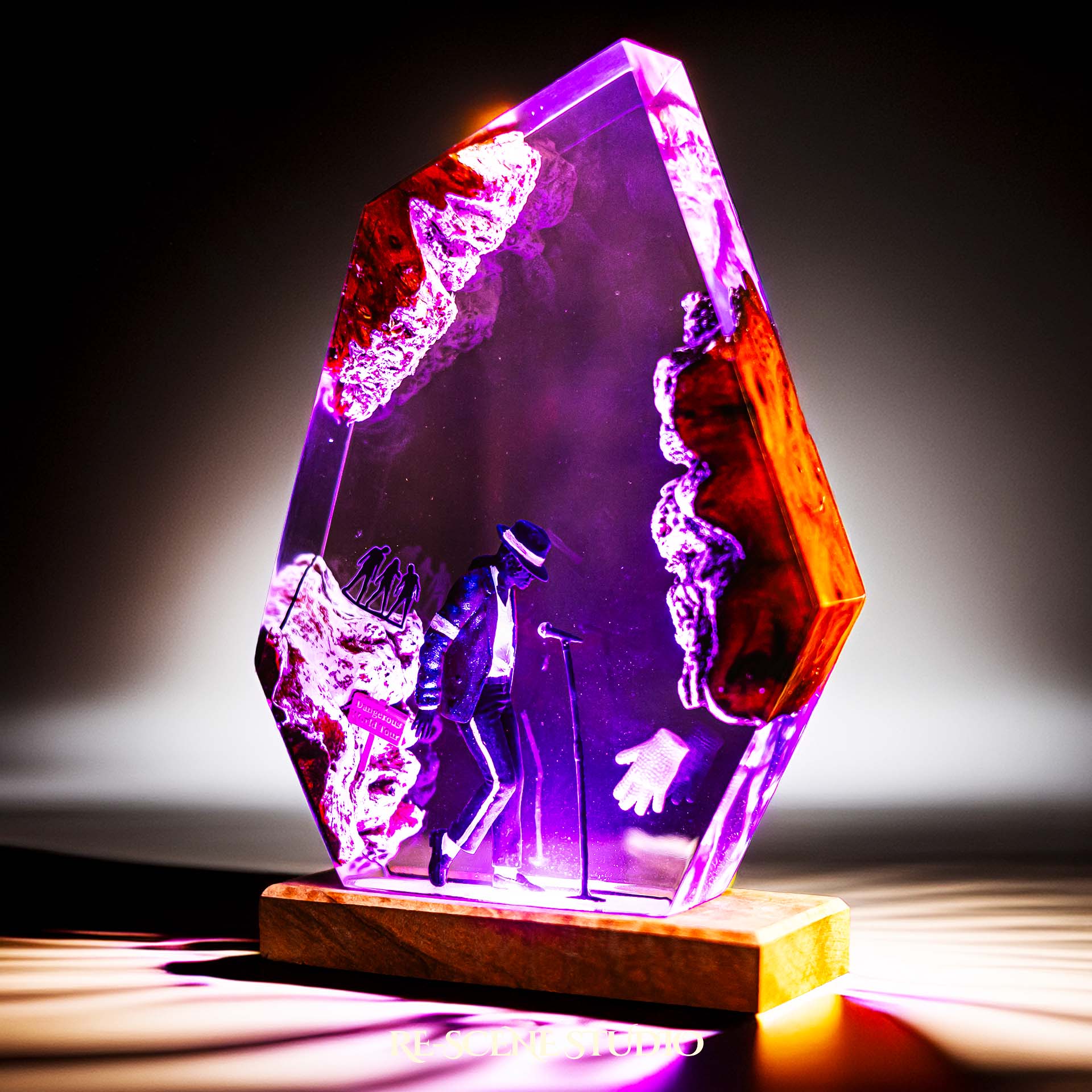 Handmade epoxy resin table lamp showing a dancer in a fedora and sparkling jacket leaning toward a microphone stand under a spotlight, on a natural wood LED base (view 7)