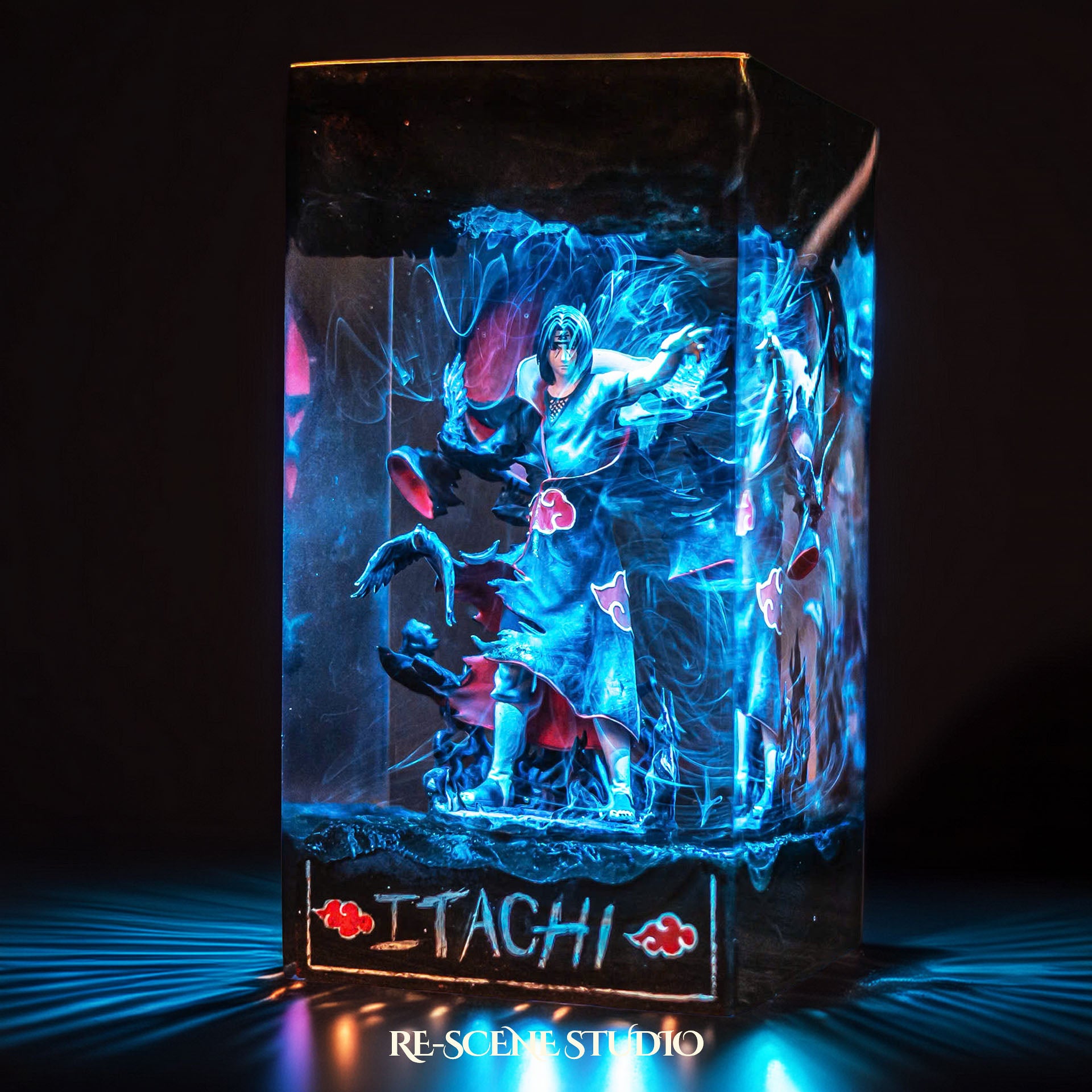Black-cloaked crow ninja before a crimson moon handmade epoxy resin LED lamp on a wooden base – close-up resin detail