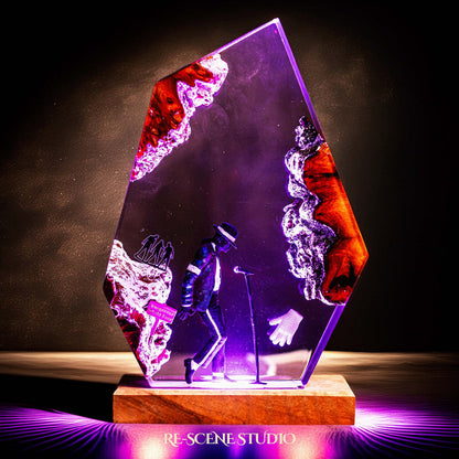 Handmade epoxy resin table lamp showing a dancer in a fedora and sparkling jacket leaning toward a microphone stand under a spotlight, on a natural wood LED base (view 2)